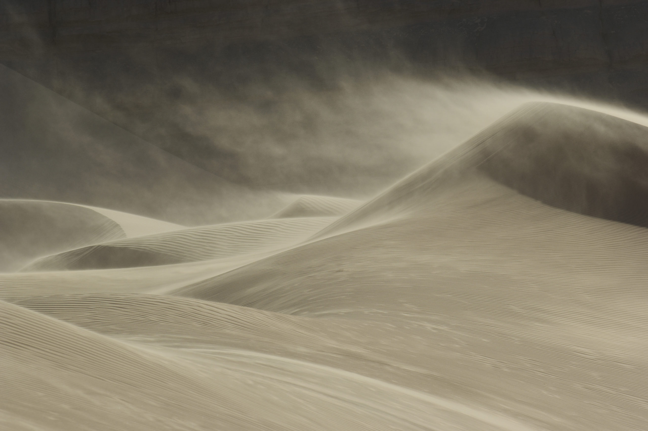 Sand blowing over sand dune in wind - Karen Lusby | Author and Coach